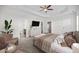 Bright and spacious main bedroom with a ceiling fan and en-suite bathroom at 205 Mcclellan Trl, Mebane, NC 27302