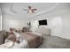 Spacious main bedroom featuring a trey ceiling, ceiling fan, and neutral decor at 205 Mcclellan Trl, Mebane, NC 27302