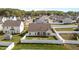 Aerial view of a well-maintained home featuring a white picket fence enclosing a spacious backyard at 205 Mcclellan Trl, Mebane, NC 27302
