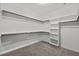 Spacious walk-in closet with built-in shelving and plenty of hanging space at 205 Mcclellan Trl, Mebane, NC 27302