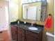 Bathroom vanity with dark countertop and plenty of drawer space at 2117 Wrenn St, Burlington, NC 27215