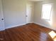 Bright bedroom features a window and beautiful hardwood floors at 2117 Wrenn St, Burlington, NC 27215
