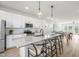 Bright kitchen with stainless steel appliances, granite countertops, and an island with barstool seating at 215 Pond View Ct # 6, Fuquay Varina, NC 27526