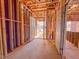 Unfinished hallway with wooden beams, concrete floors, and construction elements visible at 217 Pond Vw Ct # 7, Fuquay Varina, NC 27526