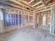 Spacious interior showcasing unfinished wood framing, wiring, and duct work for a new home at 217 Pond Vw Ct # 7, Fuquay Varina, NC 27526