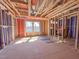 Framed interior reveals window views and construction progress of the home, showing exposed wooden framework at 217 Pond Vw Ct # 7, Fuquay Varina, NC 27526