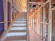 Staircase with protective covering highlights construction progress and home design in an unfinished interior at 217 Pond Vw Ct # 7, Fuquay Varina, NC 27526