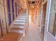 Unfinished staircase of new construction with wooden beams and temporary treads at 217 Pond Vw Ct # 7, Fuquay Varina, NC 27526