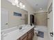 Bathroom with a dark wood vanity and a tiled shower-tub combination at 224 Clear River Pl, Cary, NC 27519