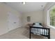 Spare bedroom with neutral walls, carpet, and a single bed with an accent table at 224 Clear River Pl, Cary, NC 27519