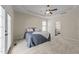 Comfortable primary bedroom offers a ceiling fan, plush carpet and access to the en suite bathroom at 224 Clear River Pl, Cary, NC 27519