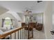 Bonus room features comfortable seating, ceiling fan, and large windows, creating a relaxing space at 224 Clear River Pl, Cary, NC 27519