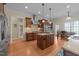 Beautiful kitchen with custom cabinets, center island, stainless appliances, and eat-in nook at 224 Clear River Pl, Cary, NC 27519