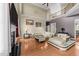 Open-concept living room featuring a fireplace, hardwood floors, and second-story views at 224 Clear River Pl, Cary, NC 27519