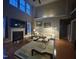 Spacious living room with high ceilings, a cozy fireplace, and stylish furniture, perfect for relaxation and entertainment at 224 Clear River Pl, Cary, NC 27519