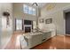 Spacious living room with fireplace, soaring ceilings, and plentiful natural light at 224 Clear River Pl, Cary, NC 27519