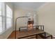 Home office space with modern desk overlooking dining area through french doors at 224 Clear River Pl, Cary, NC 27519
