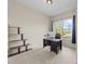 Bright home office with a large window and neutral colors to inspire productivity at 224 Clear River Pl, Cary, NC 27519