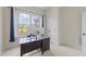 Bright office space with a large window, granite desktop, and neutral paint, providing an ideal work environment at 224 Clear River Pl, Cary, NC 27519