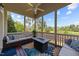 Inviting screened porch with comfortable seating area and a cozy fire pit, perfect for outdoor relaxation and entertaining at 224 Clear River Pl, Cary, NC 27519