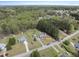 Expansive aerial view of a charming neighborhood surrounded by lush greenery and tree coverage at 230 Bradley Dr, Benson, NC 27504
