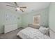 Bright bedroom featuring large windows, plush carpet, and neutral tones at 230 Bradley Dr, Benson, NC 27504