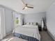 Comfortable bedroom with a cozy bed, large window, and neutral décor at 230 Bradley Dr, Benson, NC 27504