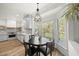 Cozy breakfast nook with a large bay window overlooking the outdoor deck and kitchen at 230 Bradley Dr, Benson, NC 27504