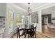 Charming breakfast nook with bay window, modern chandelier, and cozy seating at 230 Bradley Dr, Benson, NC 27504