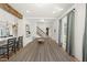 Open dining area with an expansive table, view of stairs, and light from the window and front door at 230 Bradley Dr, Benson, NC 27504