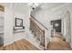 Welcoming entryway with wood floors and staircase to upper level at 230 Bradley Dr, Benson, NC 27504