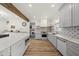 Spacious kitchen featuring an island, wooden accents, and modern appliances against patterned backsplash at 230 Bradley Dr, Benson, NC 27504