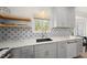 Countertop and window area of kitchen with modern faucet and patterned backsplash at 230 Bradley Dr, Benson, NC 27504