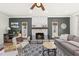 Cozy living room featuring a stone fireplace, neutral color palette, and hardwood floors at 230 Bradley Dr, Benson, NC 27504