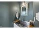 Charming powder room with stainless sink, wood countertop, and decorative mirror at 230 Bradley Dr, Benson, NC 27504
