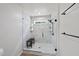 Elegant glass-enclosed shower with a built-in bench and tiled walls at 230 Bradley Dr, Benson, NC 27504