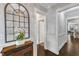 Stylish entryway enhanced by dark hardwood floors and a decorative mirror at 2321 Swansea Ln, Apex, NC 27502