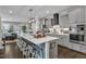 Spacious kitchen boasts a large island with seating and modern appliances at 2321 Swansea Ln, Apex, NC 27502