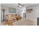 Comfortable living room with a cozy sectional sofa, wooden coffee table, and an overhead ceiling fan at 2321 Swansea Ln, Apex, NC 27502
