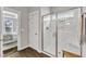 Elegant bathroom with a glass-enclosed shower and views into a bedroom, and modern fixtures at 2321 Swansea Ln, Apex, NC 27502