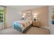 Comfortable bedroom featuring stylish decor, a colorful bedspread, and ample natural light at 25 Granite Falls Way, Youngsville, NC 27596