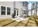 A backyard patio area with grill, umbrella, and chairs at 254 W Odell Ln, Zebulon, NC 27597