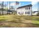 Two-story home with a large, green backyard and patio at 254 W Odell Ln, Zebulon, NC 27597