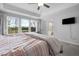 Bedroom showcasing a scenic view, tray ceilings, and en-suite bathroom at 254 W Odell Ln, Zebulon, NC 27597