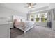 Bright bedroom features a spacious layout with a large bed and soft, neutral color palette at 254 W Odell Ln, Zebulon, NC 27597