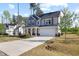 Charming two-story home with a welcoming front porch and a two-car garage on a well-maintained lawn at 254 W Odell Ln, Zebulon, NC 27597
