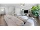 Spacious living room offering a large sectional sofa, built-in shelving, and an abundance of natural light at 254 W Odell Ln, Zebulon, NC 27597