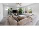 Comfortable living room showcasing a sectional sofa, a large television, and plenty of natural light at 254 W Odell Ln, Zebulon, NC 27597