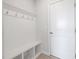 Bright mudroom with coat hooks, bench seating, and storage, perfect for organizing entryway essentials at 254 W Odell Ln, Zebulon, NC 27597