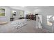 Spacious upstairs playroom with carpet flooring, built-in bookcases, and an abundance of natural light at 254 W Odell Ln, Zebulon, NC 27597
